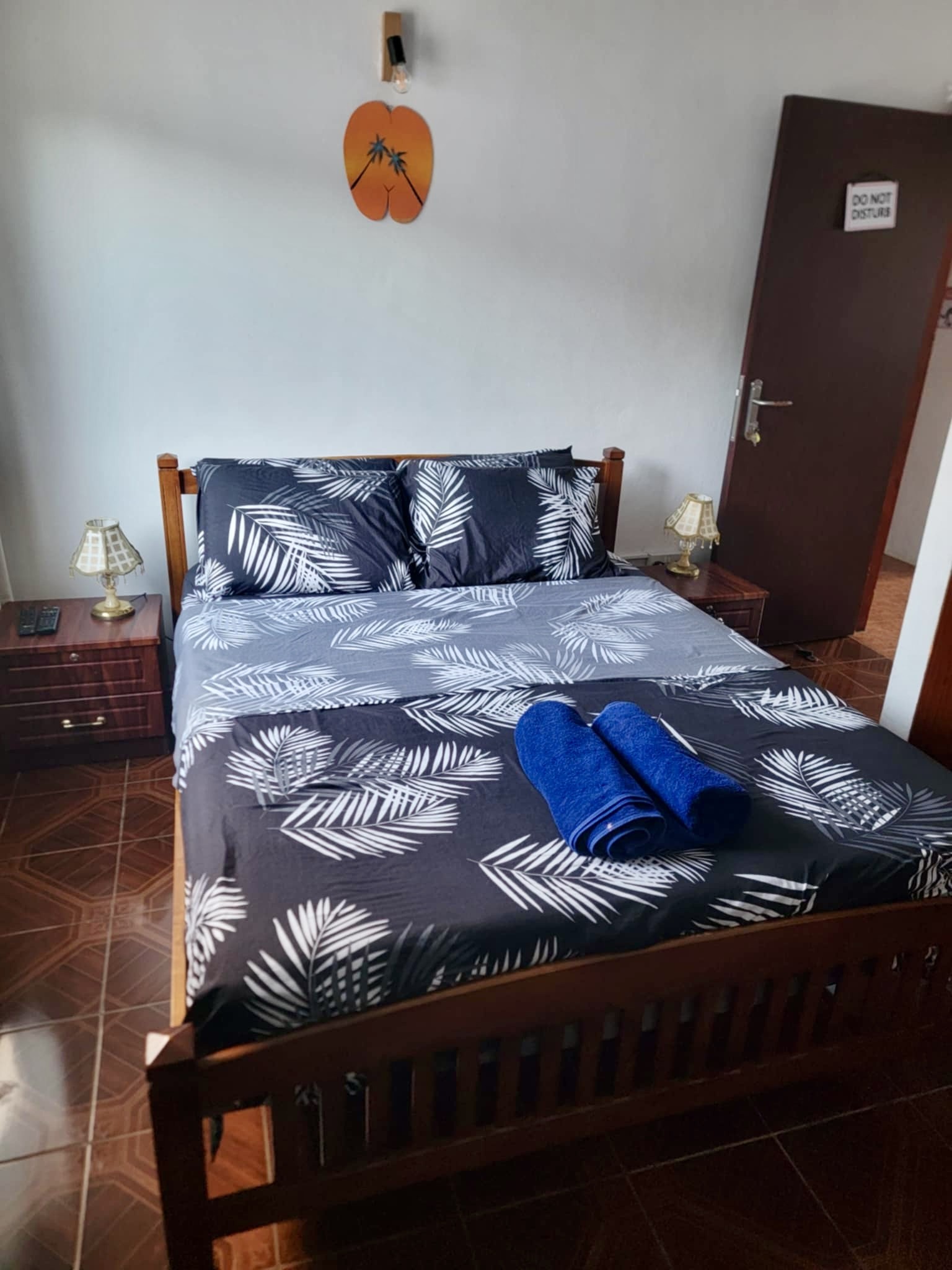 Comfortable bedroom with tropical bedding